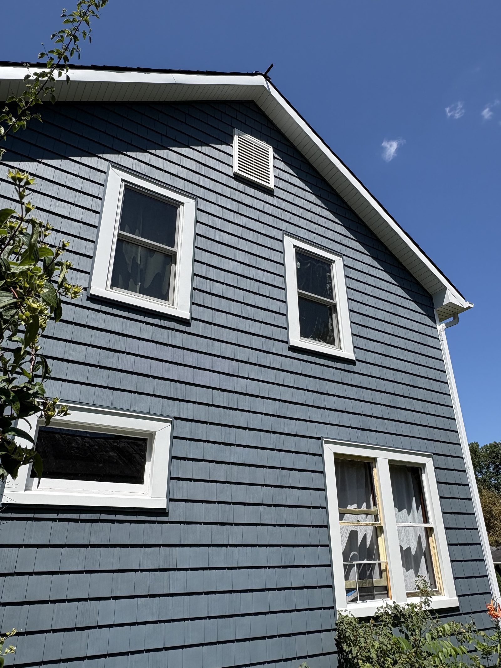 Blue-gray siding and gable detail